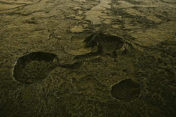 Dark green moss-covered lava fields on Iceland's Reykjanes peninsula sprawls out in all directions.